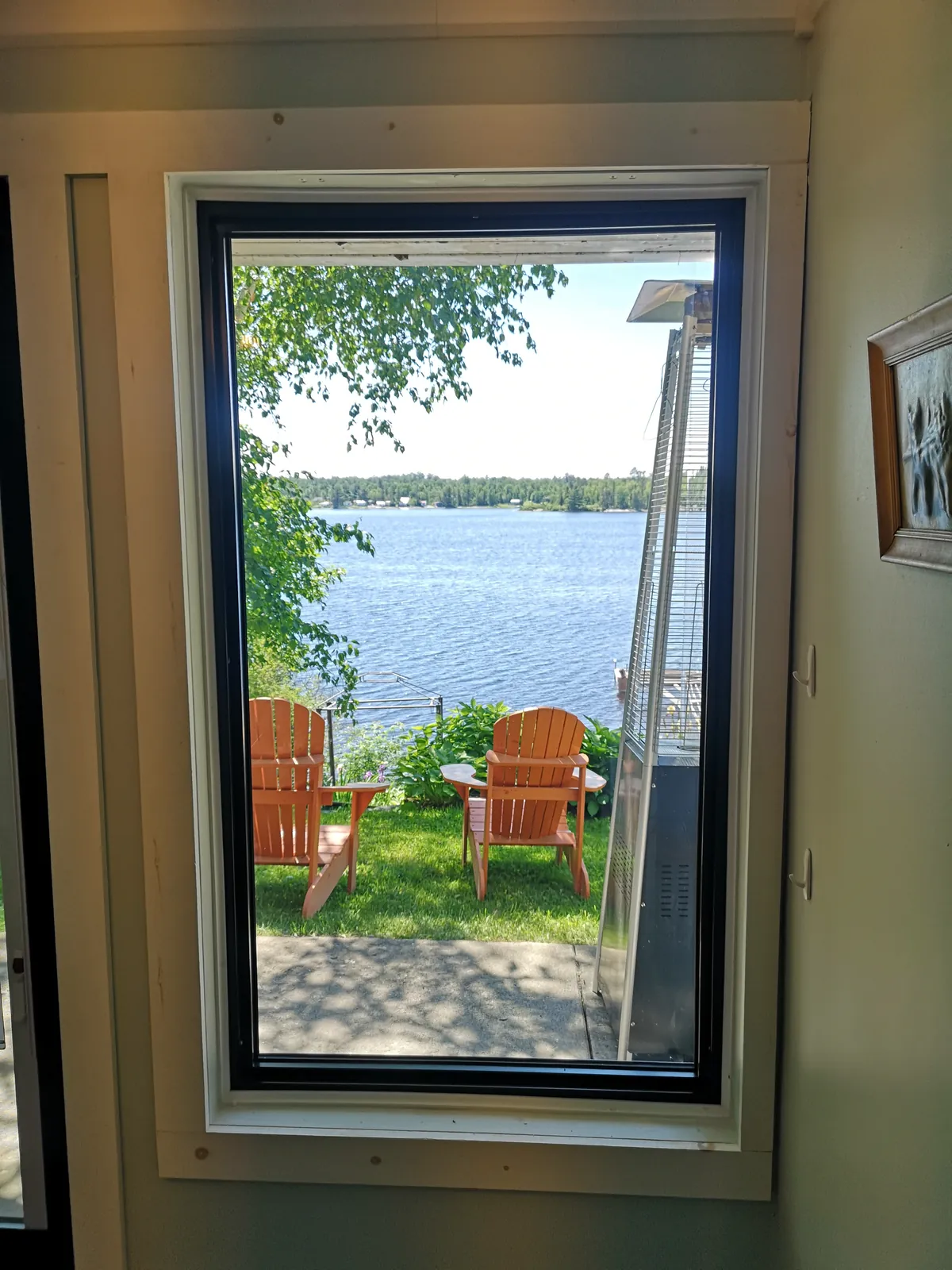 Black casement window, lakeside cottage