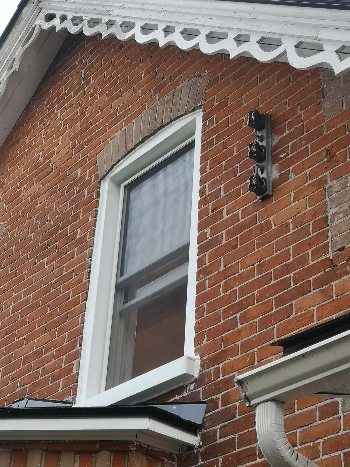 White casement in heritage brick home