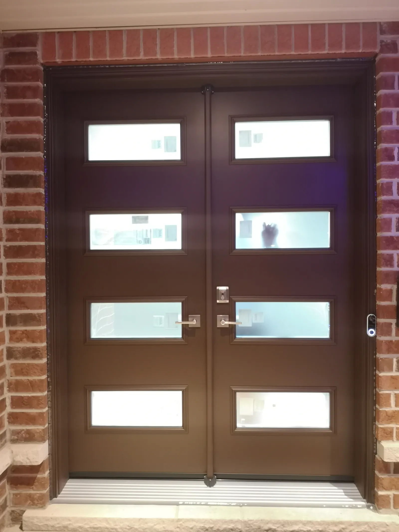 Brown double doors with glass panels