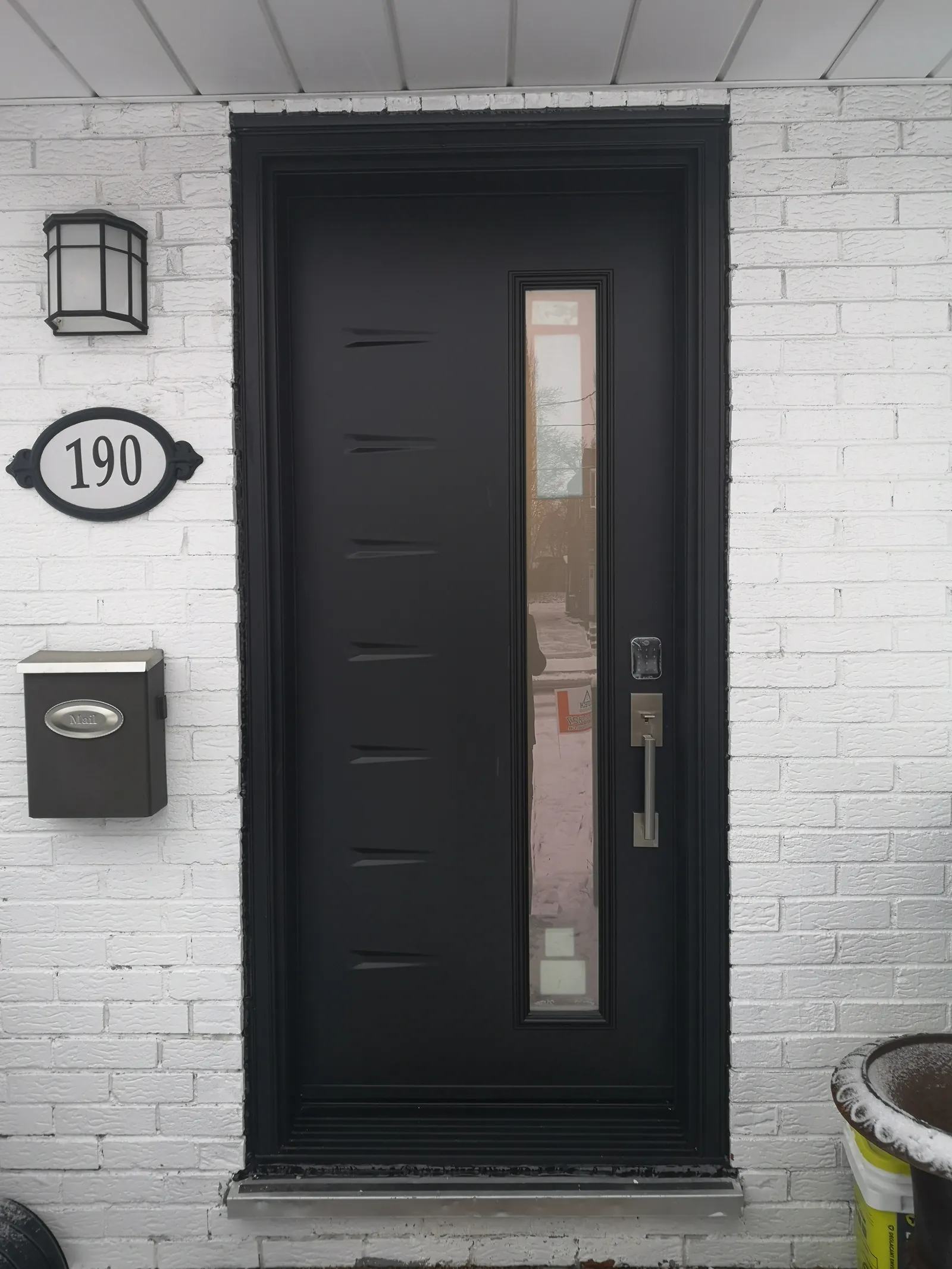Black modern door with linear glass