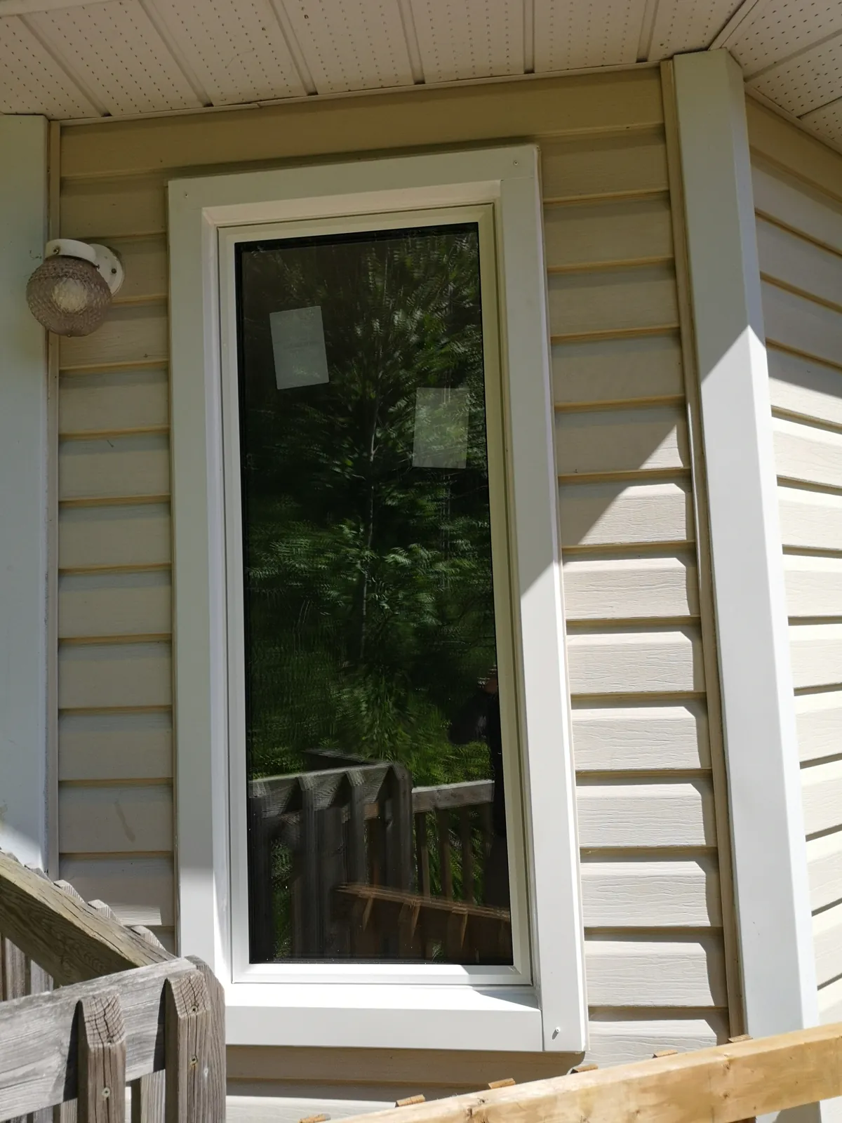 Black slider window, lake view
